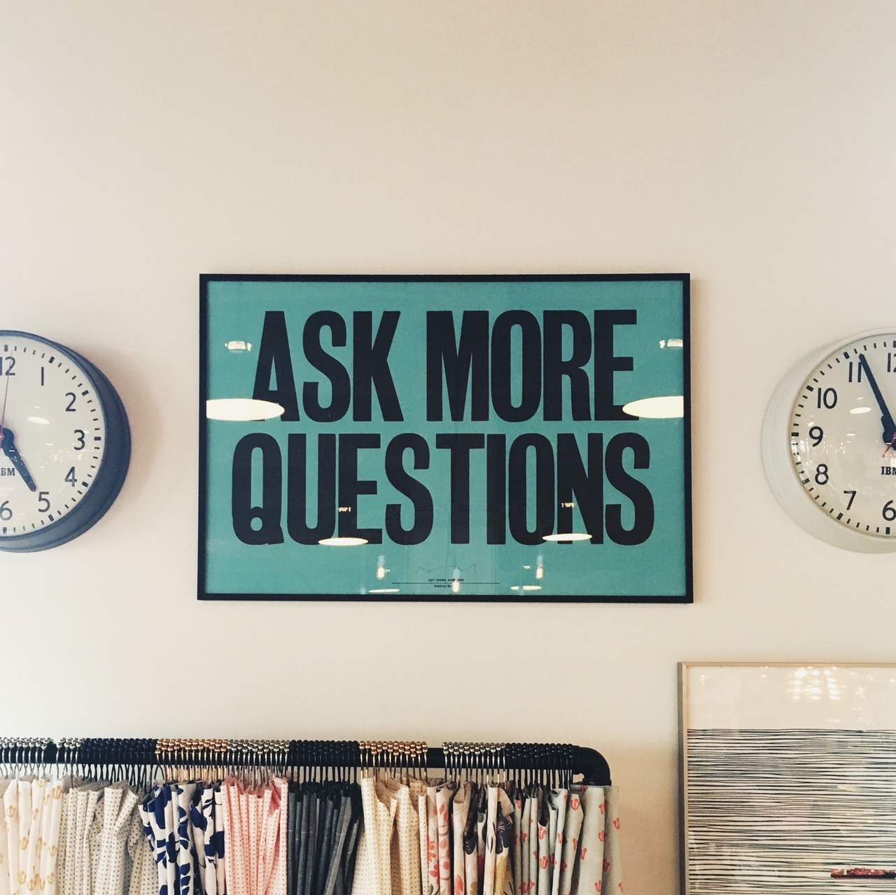 Sign on office wall: Ask More Questions